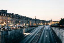 Traffic and lights in street at dusk. Bordeaux